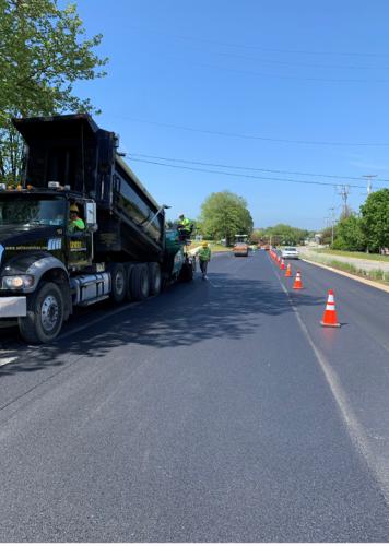 ASPHALT__0000s_0001_Vogele Paver Pushing a Loaded Truck on Swedesford Rd..jpg